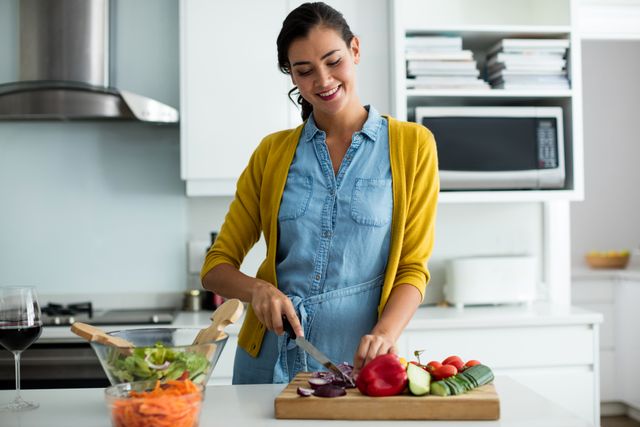 Woman preparing food in the kitchen at home
