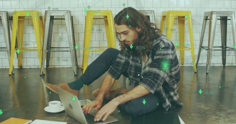 Digital nomad analyzing market trends in cafe setting