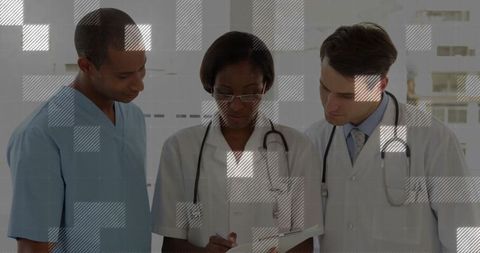 Healthcare Team Collaborating in Hospital Corridor with Medical Equipment