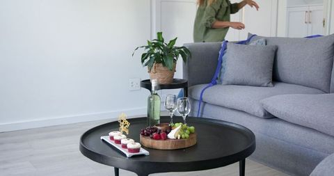 Home birthday celebration with wine and sweets on coffee table