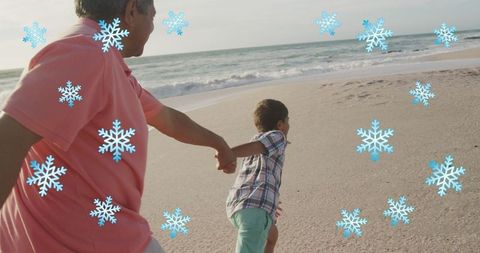 Grandfather and Grandson Bonding on Oceanfront with Snowflake Overlay