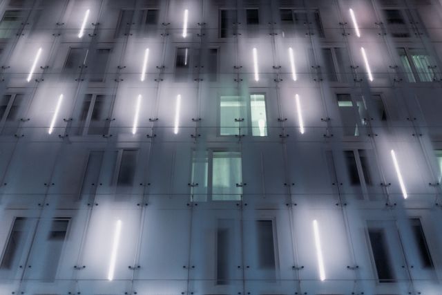 Modern Building Facade with Illuminated Vertical Lines - Download Free Stock Photos Pikwizard.com