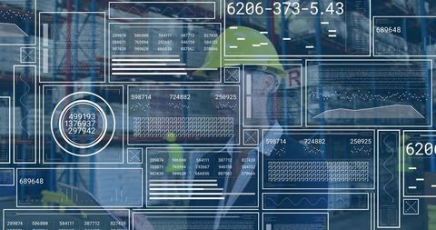 Warehouse manager monitoring digital inventory dashboards with HUD overlays