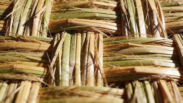 Handwoven reed mat revealing natural texture and basketweave pattern