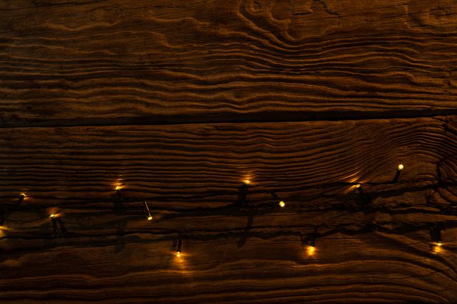 copy space with electric garland on a wooden background