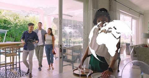 Hosting friends in modern home with smart globe overlay preparing elegant dinner table