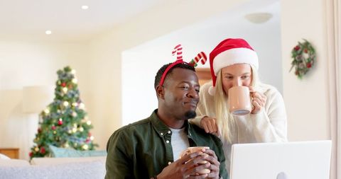 Festive couple enjoying christmas spirit at home