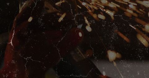 Close-up of metal grinding with angle grinder producing sparks