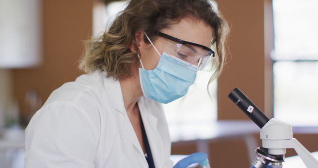 Female Scientist Conducting Laboratory Research With Microscope - Download Free Stock Images Pikwizard.com