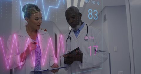 Doctors Analyzing Digital Heart Monitor Data in Hospital Corridor - Download Free Stock Images Pikwizard.com