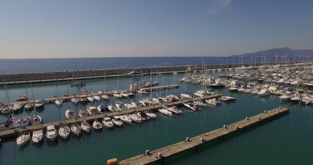 High Angle View of Boats Moored at Transparent Harbor on a Sunny Day - Download Free Stock Videos Pikwizard.com