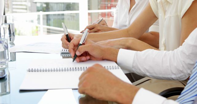 Group of Business Professionals Taking Notes During Meeting - Download Free Stock Images Pikwizard.com