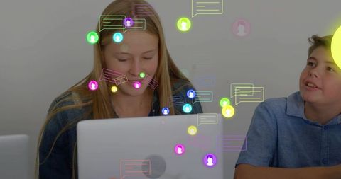 Teen Students Collaborating on Laptop with Floating Chat Icons Representing Online Learning