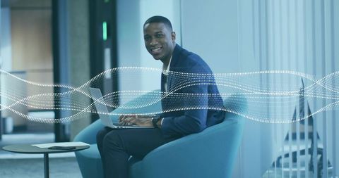 Professional Businessman Working on Laptop in Modern Lounge Area