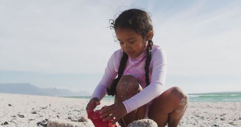 Young Girl Building Sand Castle on Sunny Beach - Download Free Stock Images Pikwizard.com