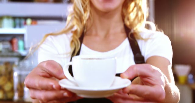 Barista Serving Fresh Coffee in Brightly Lit Café - Download Free Stock Images Pikwizard.com