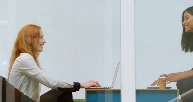 Two Women Having Casual Meeting and Smiling in Modern Office - Download Free Stock Images Pikwizard.com