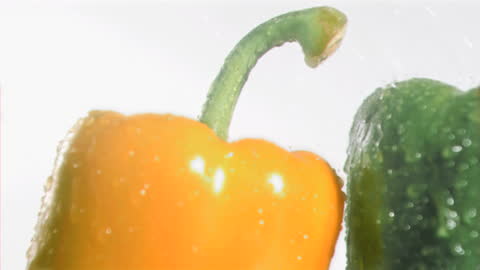 Vibrant Peppers Showered with Water Droplets