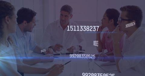 Business team discussing digital strategy in modern office meeting