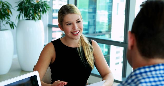 Woman Conducting Job Interview in Modern Office Setting - Download Free Stock Images Pikwizard.com