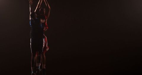 Intense Basketball Duel in Mid-Air Shot - Download Free Stock Images Pikwizard.com