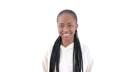 Confident Woman with Braided Hairstyle in White Hoodie