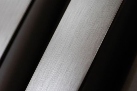 Close-up of brushed metal surface showing texture