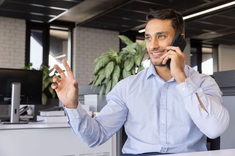 Business professional in modern office on phone call