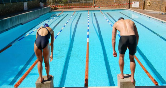 Male and Female Swimmers Preparing to Dive at Outdoor Pool - Download Free Stock Images Pikwizard.com