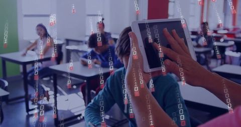 Teacher Guiding Student Using Tablet in Digital Classroom with Binary Code Overlay