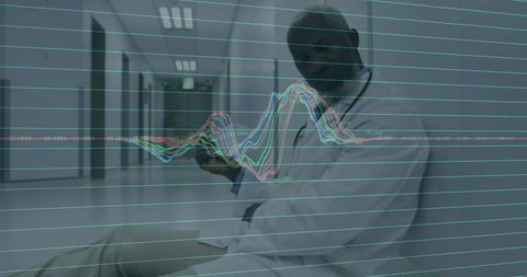 Male Doctor Analyzing Medical Data in Hospital Hallway
