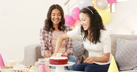 Two Women Enjoying Birthday Celebration at Home