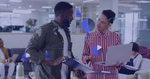 Collaborative Business Team Discussing Financial Data in Modern Office