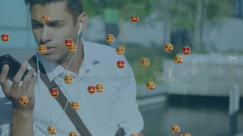 Man Using Smartphone Surrounded by Playful Emoticons