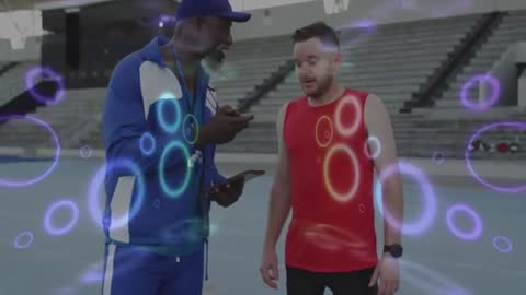 Coach Analyzing Performance Data with Athlete on High-Tech Track