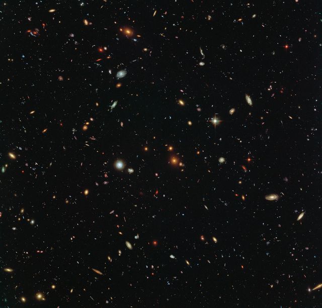 This image presents a field of thousands of vibrant galaxies captured by the Hubble Space Telescope. Stars from the Milky Way are also visible, providing a stunning contrast against the background. Captured during the Frontier Fields program, this shot aids in understanding the universe's appearance in various directions. Suitable for educational materials, astronomy studies, space exploration articles, and promoting the beauty and mystery of the cosmos.