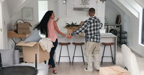Cheerful Couple Moving Into New Loft Style Modern Home