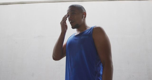 Tired Athlete in Blue Tank Top Taking a Break - Download Free Stock Images Pikwizard.com