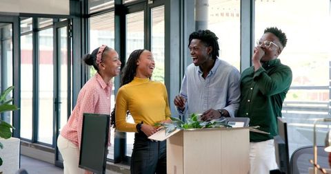 Diverse Team Welcoming New Colleague with Enthusiasm