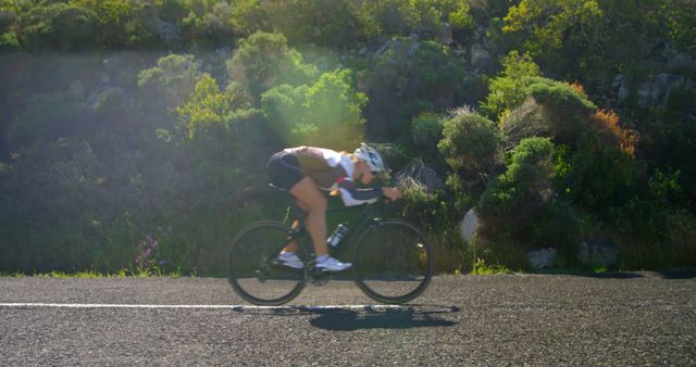 Cyclist in Professional Gear Riding on Mountain Road - Download Free Stock Images Pikwizard.com