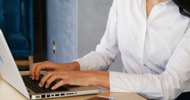 Person Working on Laptop in Office Environment - Download Free Stock Images Pikwizard.com