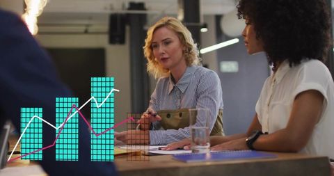 Business leaders reviewing documents with digital chart overlay for strategy and analytics