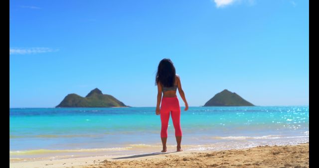 Woman Enjoying Scenic Beach View with Mountains in Background - Download Free Stock Images Pikwizard.com