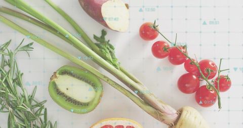 Scallion bundle crossing minimalist grid flatlay with cherry tomatoes, kiwi, vibrant citrus slices