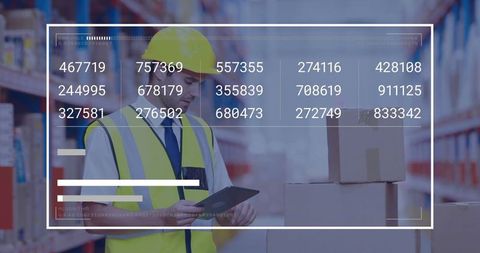 Warehouse worker using tablet with statistical data overlay