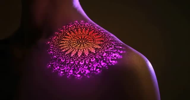 Glowing Mandala Projection on Back with Shimmering Effects