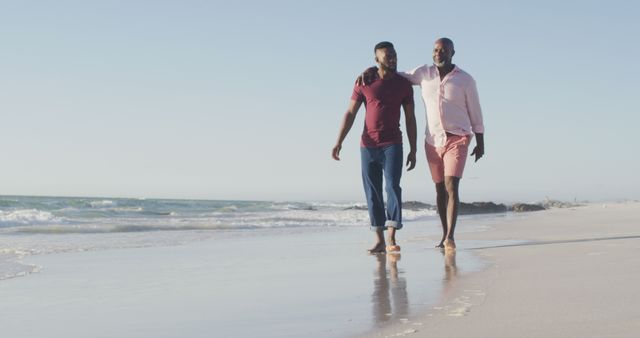 Image of happy african american senior father and adult son walking on beach - Download Free Stock Photos Pikwizard.com