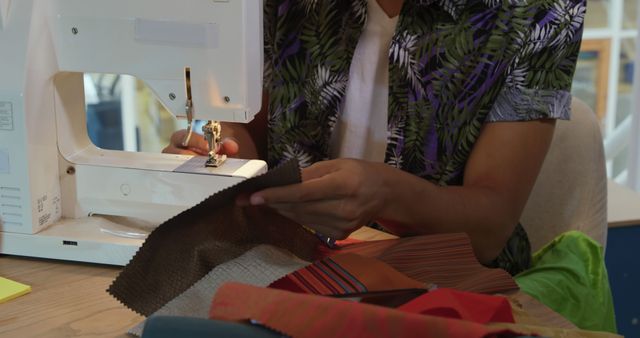 Person Sewing Fabrics on a Machine in Creative Workspace - Download Free Stock Images Pikwizard.com