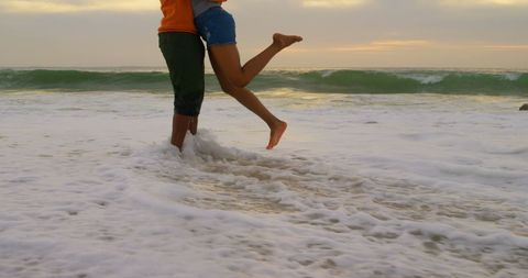 Romantic Beach Hug at Sunset with Ocean Waves
