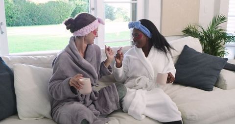 Diverse Friends Enjoying Skincare Routine and Relaxing Together at Home